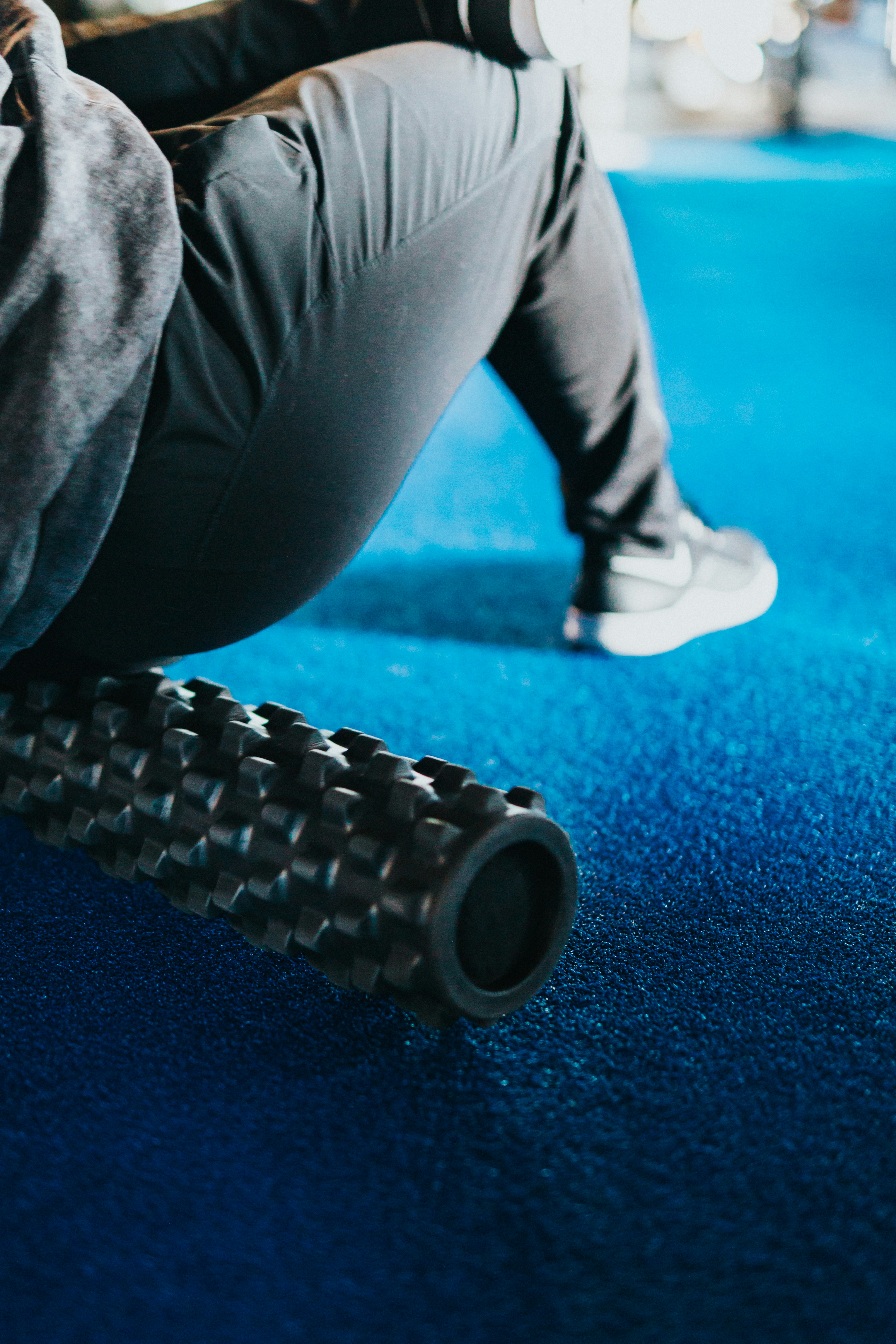 Person using foam roller on hips